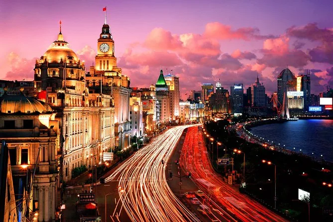 The Bund at sunset with light trails from traffic along the waterfront
